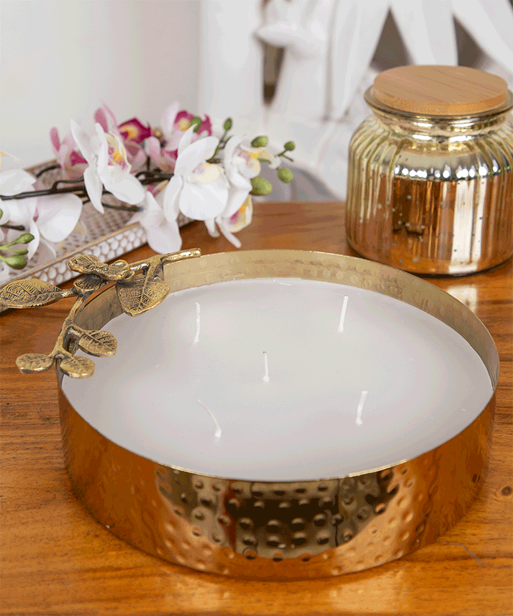 Hand Hammered Gold Metal Urli With Fragrance Wax And Flower On Stem Embellishment